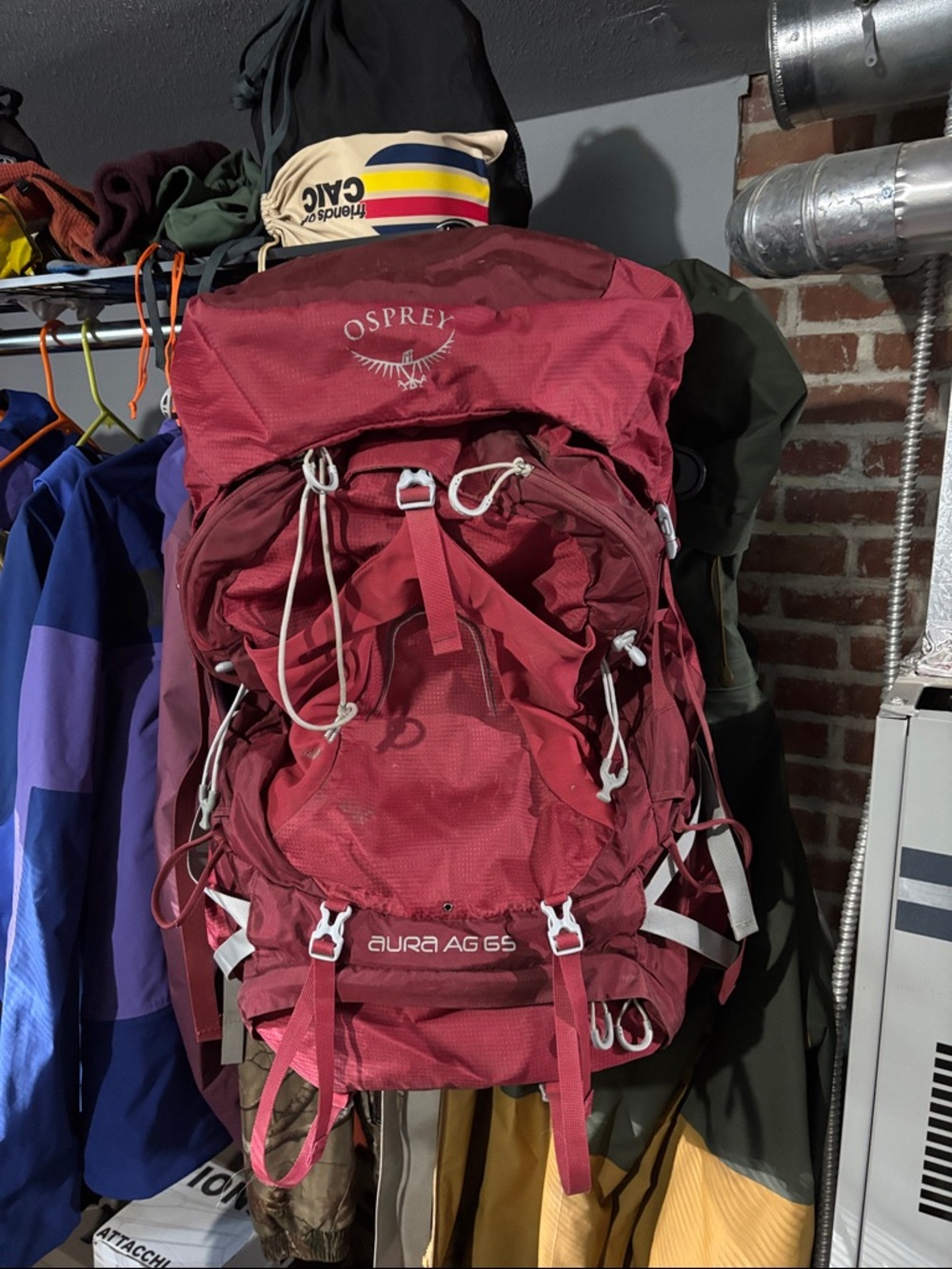 OSPREY Aura AG 65 Backpack in Deep Red with White Accents